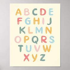 a poster with the letters and numbers painted in pastel colors on it's white background