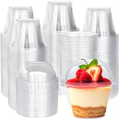 there are many plastic cups with strawberries on them