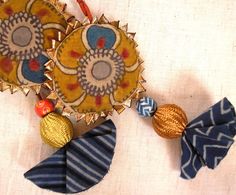 an ornament made out of fabric and beads