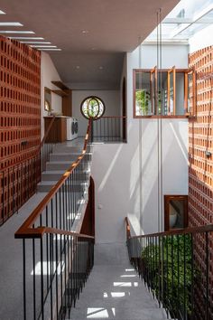 the stairs are made out of wood and metal, with circular windows on each side