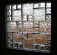 a glass block window in a dark room