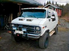 a white truck parked in front of a building