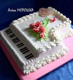 a sheet cake decorated with flowers and piano keys