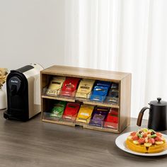 a coffee maker and some pastries on a table