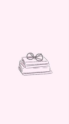 a stack of books with glasses on top