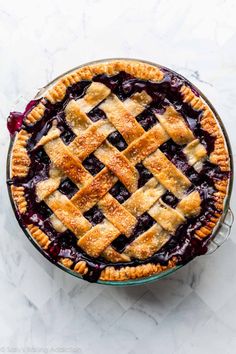 a blueberry pie with latticed crust on top