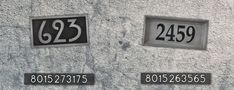 the numbers on the wall are numbered in black and white, but they appear to be from different times