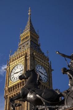 the big ben clock tower towering over the city of london, england with statue of horse and rider