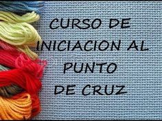 several skeins of yarn with the words cuso de iniciacion al punto decruz