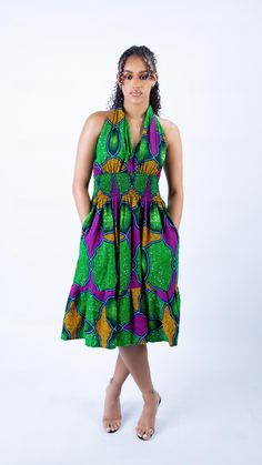 Step into summer with this vibrant Green Ankara Backless Summer Midi Dress, a perfect fusion of traditional African heritage and modern fashion. This exquisite piece is designed for women who love to embrace their cultural roots while staying chic and stylish. Features & Design: Crafted from high-quality, 100% cotton Ankara fabric, known for its durability and bold, eye-catching patterns. The fabric is soft and breathable, ensuring that you stay comfortable while making a fashion statement.  Thi Women African Wear, Green Ankara, Summer Midi Dress, Dress African Print, Backless Midi Dress, Dress Open Back, African Heritage, Halter Neck Dress, Dress Knee Length