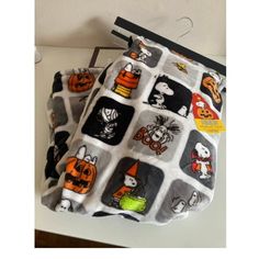 a bag that has some pictures on it and is sitting on top of a table