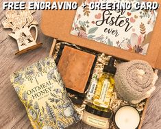 an open gift box filled with essentials for mother's day and free engraving