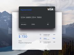 a visa card with mountains in the background and water on the other side, as well as trees