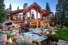 a large house with a hot tub in front of it