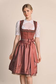 Description Item description Our chic dirndl Marielle is a dream come true for all our traditional costume lovers who want to combine a mix of classic elegance and tradition. The dirndl dress features romantic colors and traditional cuts. Dirndl Marielle is a classic eye-catcher thanks to its straight neckline with decorative frog-shaped trim along the neckline. The skirt impresses with its interesting diamond pattern. The shimmering apron adds a harmonious accent to the overall outfit. Our dirn Dirndl Pattern, Dirndl Blouse, Novelty Hats, Overall Outfit, Dirndl Dress, Romantic Colors, A Dream Come True, Traditional Costume, Candle Accessories