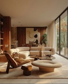 a living room filled with furniture and large windows