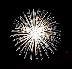 fireworks exploding in the dark sky at night