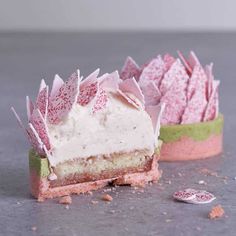 a piece of cake sitting on top of a table next to a cupcake tin