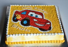 a birthday cake with cars on it