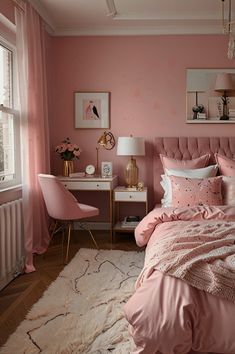 a bedroom decorated in pink and white with a bed, chair, desk and pictures on the wall