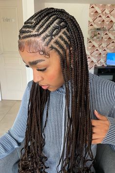 This hairstyle features amazing cornrow braids that begin at the front and smoothly transition down to combine with lengthy box braids, crafting an intricate design across the head. The nearly black color of the braids gives off an enigmatic and profound charm, highlighted by the delicate hints of brown that catch the - Click to see more of Unlock the Enigma: 25 Captivating Dark Hairstyles for the Bold and Beautiful and follow us for more hairstyle ideas. // Photo Credit: Instagram @jerria_hair Almost Black Hair, Dark Hairstyles, Black Hair Styles, Black Curls, Big Box Braids Hairstyles, Goddess Braids Hairstyles, Quick Natural Hair Styles, African Hair Braiding Styles, My Muse