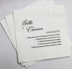 four white napkins with black lettering on them