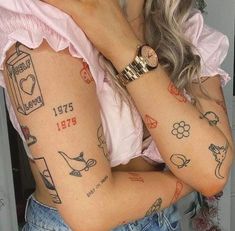 a woman with many tattoos on her arms