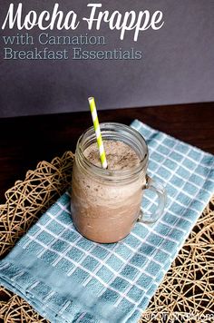 a drink in a mason jar sitting on a blue napkin with the words mocha tropee written above it