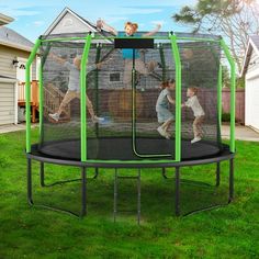 two children are playing on a trampoline in the yard