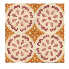 four square tiles with pink and white designs on orange ground, one in the shape of a flower