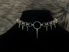 14, 16, or 18 inch total length (clasp + chain + o ring) helm choker! Features one large spike charm and 6 small spike charms. Chainmail and o ring are aluminum and stainless steel and charms are silver plated Clasp is stainless steel. *now comes with a 1 inch handmade stainless steel extension chain* 14 inch choker is adjustable up to 15 inches. 16 inch choker is adjustable up to 17 inches. 18 inch choker is adjustable up to 19 inches. Necklace is on a hand stamped/ hand drawn backing and come Nickel Free Punk Style Choker, Metal Chain Dangle Choker, Metal Chain Choker With Dangle, Handmade Metal Dangle Choker, Gothic Metal Jewelry For Fantasy Events, Gothic Silver Choker With Adjustable Chain, Gothic Chain Jewelry For Festivals, Gothic Festival Jewelry With Chain, Handmade Metal Edgy Choker