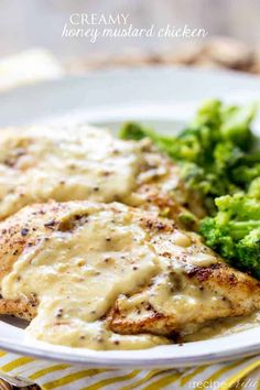 chicken with gravy and broccoli on a plate