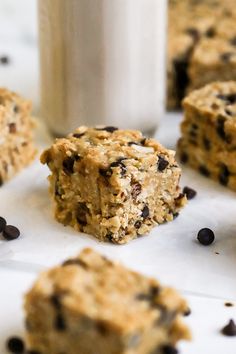 oatmeal bars with chocolate chips and a glass of milk on the side