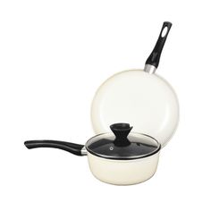 an empty pan with a black handle and lid sitting on a white surface next to a frying pan