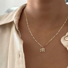 Elevate your style with our Everyday Old English Initial Necklace, featuring sparkling cubic zirconia details. This piece adds a touch of elegance and personalization to your daily look. Choose single or double letters—up to 2 letters only. Choose between 3 different types of chains and lengths. Important: Please select an Old English Initial Charm (+$12) to complete your purchase. Without the charm, you’ll receive just the chain. Why You'll Love It: Versatile Design: Perfect for wearing solo or Elegant Letter Beads Name Necklace For Personalized Gift, Elegant Name Necklace With Letter Beads For Anniversary, Trendy Everyday Letter-shaped Jewelry, Trendy Personalized Letter Jewelry Gift, Elegant Initial Pendant Necklace With Letter Beads, Elegant Letter Beads Name Necklace Gift, Elegant Name Necklace With Letter Beads As Gift, Anniversary Letter Beads Name Necklace With Initial Pendant, Anniversary Initial Pendant Name Necklace With Letter Beads