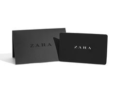 a black card with the word zara on it next to an open one - sided card