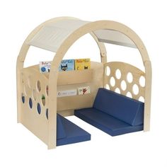 a child's play area with blue cushions