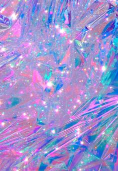 an abstract background with many colors and sparkles