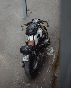 a white and black motorcycle parked in a parking lot