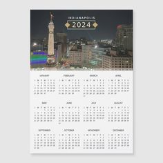 a calendar with an image of the city at night in indiana, usa on it