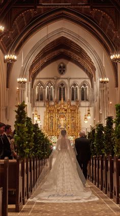 the bride and groom are walking down the aisle