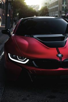 a red sports car parked on the street