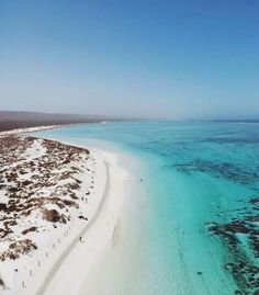 an aerial view of the beach and ocean