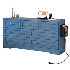 a blue dresser with an electronic device on top