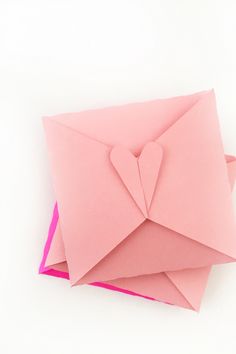 folded pink paper with a heart on it