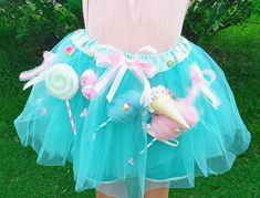 Pretty Candyland/Sweets Themed Tutu Skirt for Both Ladies and Kids! 😍.    You'll find a little bit of everything on this cutie! 🍦 Choose a skirt color. Either mint green as shown or light pink.  🍦 This is a three-layer skirt and will  measure about mid thigh.  🍦 It is decorated with:  * An upside down vanilla ice cream with sprinkles leaning against a pink cotton candy.  * A  swirl Lollipop, a light blue cotton candy, two pink ice cream scoops with sprinkles, pink ruffled bows,  * Sweet char Sweet Party Skirt, Playful Spring Tutu Dress For Costume Party, Playful Tutu Dress For Spring Costume Party, Cute Spring Tutu Dress For Costume Party, Tutus For Women, Candy Land Costumes, Ice Cream Outfit, Ice Cream With Sprinkles, Candy Photoshoot