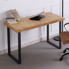 an office desk with a chair next to it