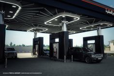 an image of a gas station with cars at it