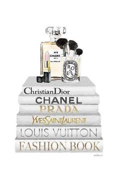 chanel perfumes on top of books with the words fashion book written below them