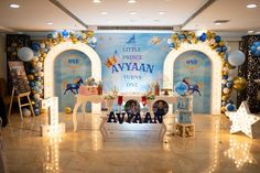 a children's birthday party set up with balloons and decorations